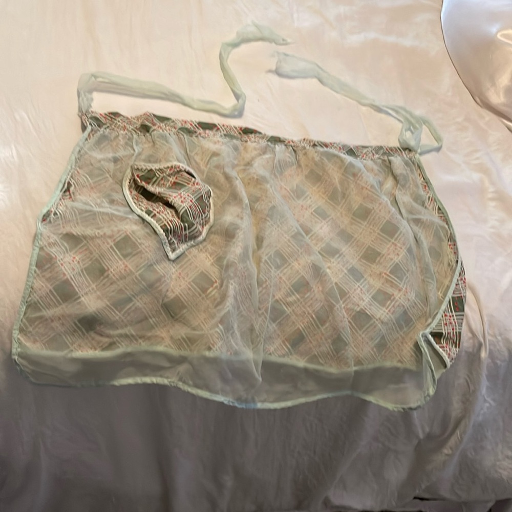Light green dark green apron torn